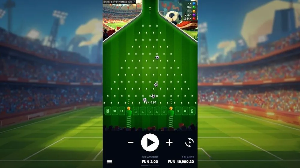 Double Pop Plinko: Goals Basisrunde: grünes Nagelbrett im Fußballstadion, fallende Bälle, Auszahlungsslots von 0,2 bis 50, Multiplikator-Leiter bis 1024x, Einsatz 2,00